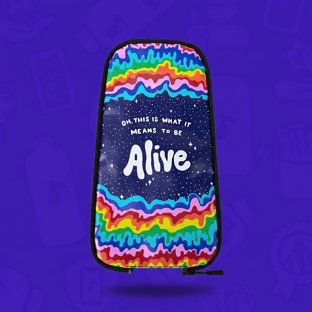 The Alive Skin for a Lunchbox hydration pack, featuring a center starry night sky with the white script quote "Oh, this is what it means to be Alive," framed by vibrant melting rainbow waves, floating with a drop shadow against a branded purple background.