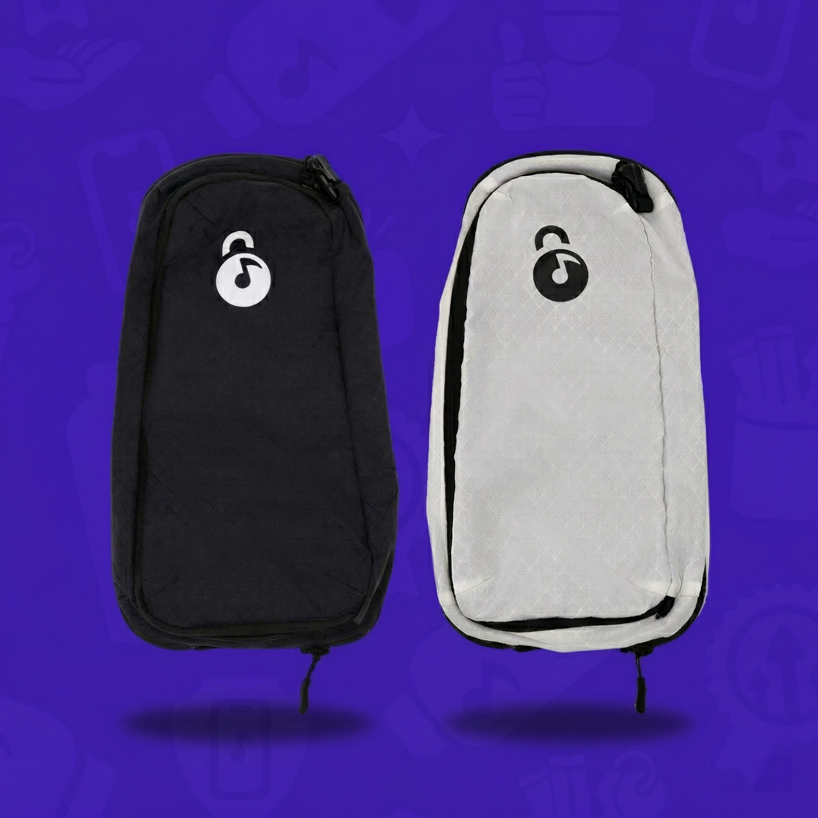 Two Extra Storage Skins for Lunchbox hydration packs, one in black and one in white, shown side-by-side with a drop shadow on a vibrant purple background.