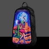 The Lunar Lasso Skin zipped onto a black Lunchbox hydration pack, featuring a cosmic disco cowgirl holding a disco ball under a large blue moon in a desert landscape, shown against a gray background.