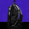 Three-quarters rear view of the clear anti-theft hydration pack by Lunchbox, highlighting the black padded mesh back panel, adjustable shoulder straps, and transparent body against a vibrant purple background