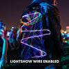 Lunchbox Hydration Pack illuminated at night with glowing, zigzagging EL lightshow wire and decorative chains, with text overlay reading "LIGHTSHOW WIRE ENABLED".