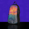 A Lunchbox hydration pack with the Nebula Skin, featuring an ethereal dreamscape design with swirling orange clouds and blue dragon fish, displayed on a black pack against a solid purple background