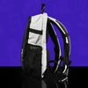 Profile view of the white anti-theft hydration pack by Lunchbox, featuring black trim and mesh side pockets, displayed against a vibrant purple background
